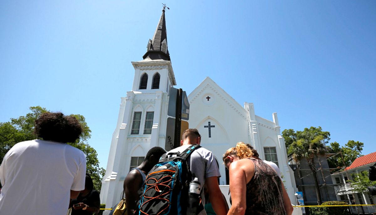 Mourners pay their respects outside Emanuel African Methodist Episcopal Church in Charleston, South Carolina, June 18, 2015.         (Reuters/Brian Snyder)