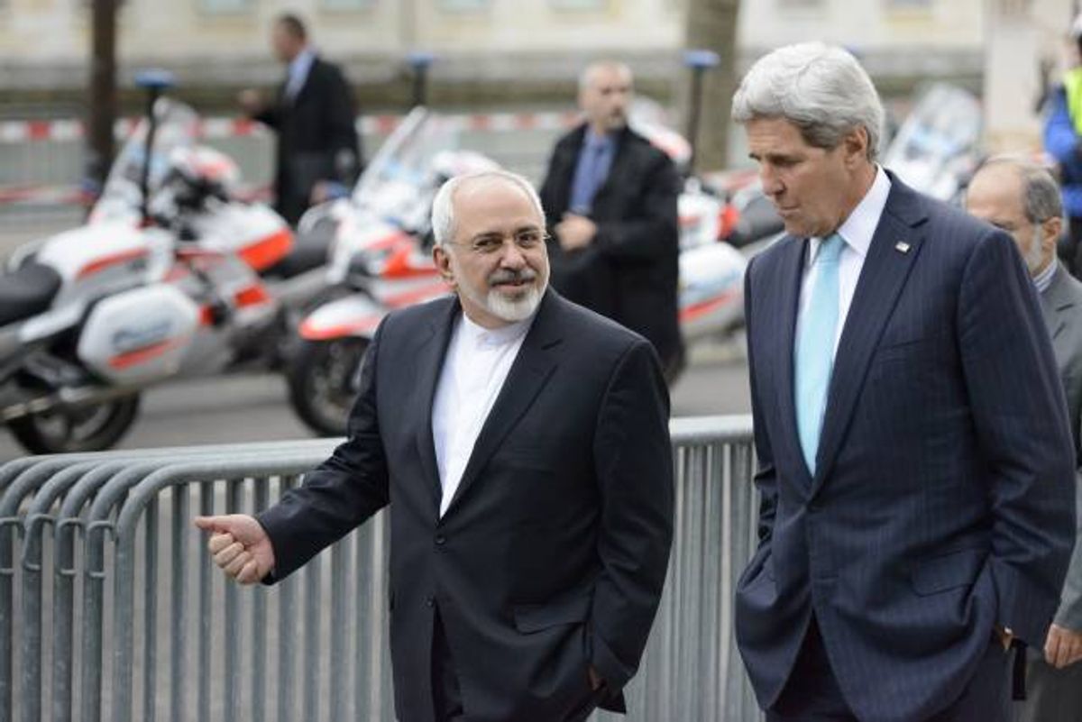 U.S. Secretary of State John Kerry speaks with Iranian Foreign Minister Mohammad Javad Zarif  (Laurent Gillieron/Keystone via AP)