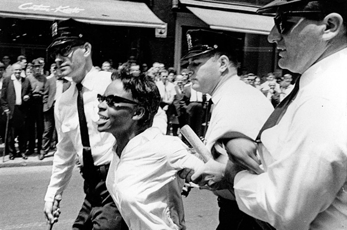 Bertha Gilbert, 22, is led away by police after she tried to enter a segregated lunch counter in Nashville, Tenn., on May 6, 1964.     (AP)