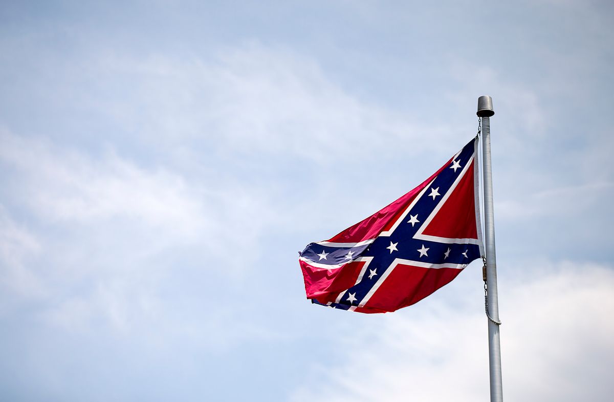 A Confederate flag flies at the base of Stone Mountain Tuesday, June 30, 2015, in Stone Mountain, Ga. (AP Photo/David Goldman)  (AP)