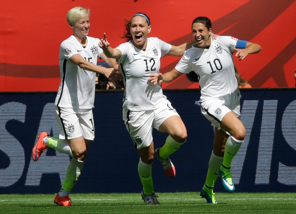 From left, United States' Megan Rapinoe, Lauren Holiday, and Carli Lloyd celebrate after Lloyd scored her second goal of the match against Japan during the first half of the FIFA Women's World Cup soccer championship in Vancouver, British Columbia, Canada, Sunday, July 5, 2015.    (AP/Elaine Thompson)