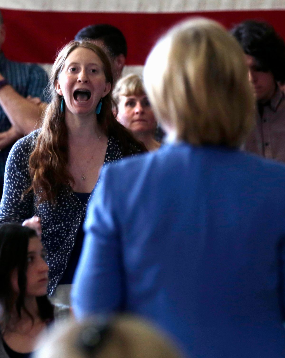 Giselle Hart of Dover, N.H., an environmental activist and student at the University of New Hampshire, interrupts and yells at Democratic presidential candidate Hillary Rodham Clinton, while asking a question during a town hall meeting in Dover, NH, Thursday, July 16, 2015. (AP Photo/Charles Krupa)  (AP)