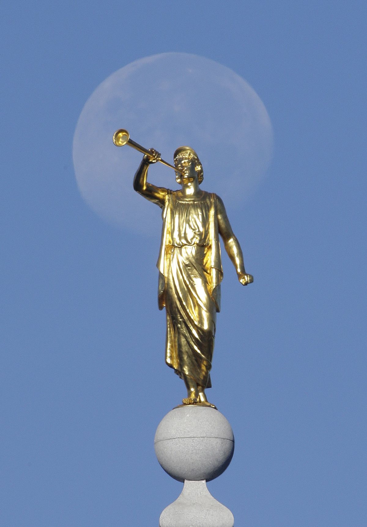 FILE - In this Sept. 11, 2014, file photo, the angel Moroni statue sits atop the Salt Lake Temple, at Temple Square, in Salt Lake City.  (AP Photo/Rick Bowmer, File)