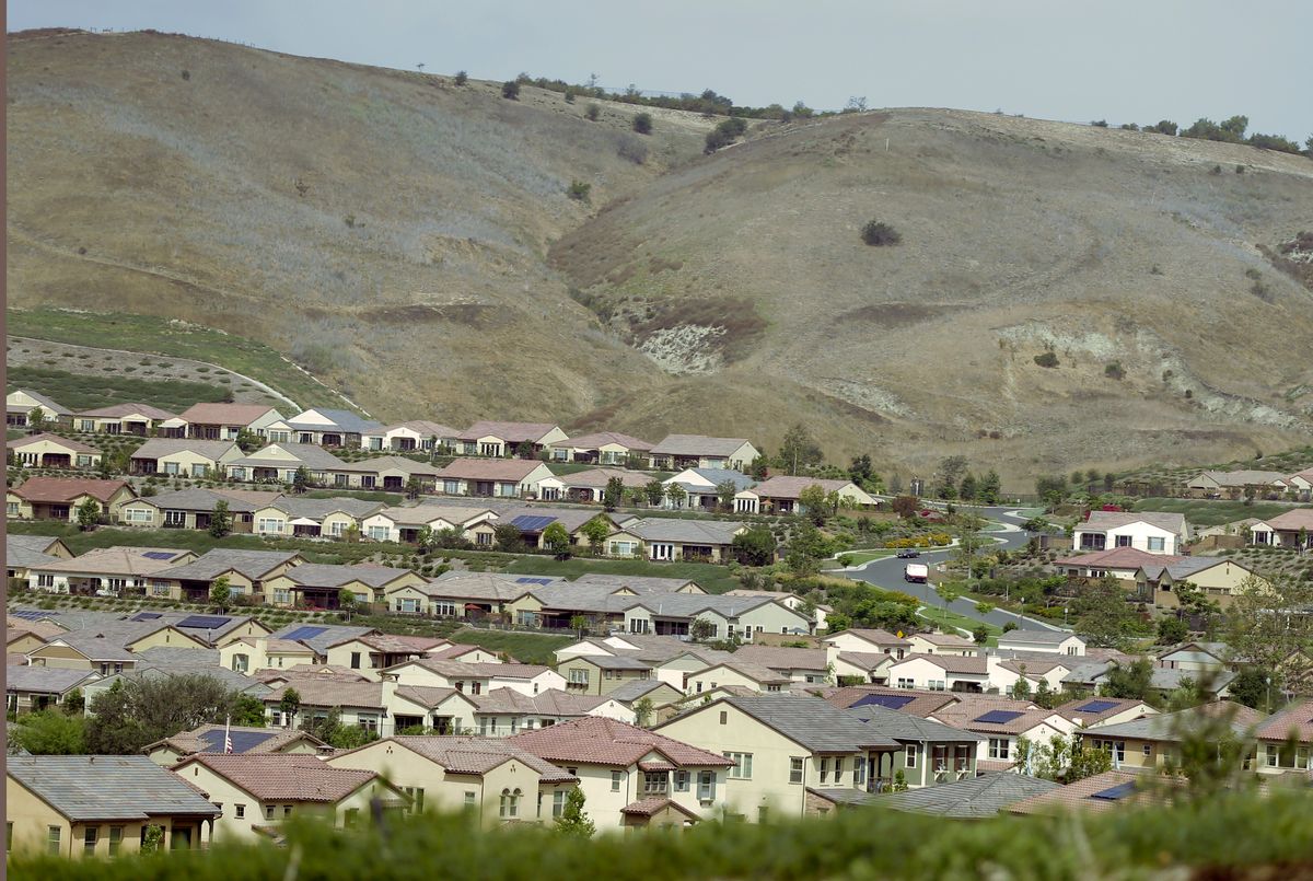 Homes back up against dry brown hills Thursday, July 2, 2015 in Rancho Santa Margarita, Calif., in Orange County. (AP Photo/Chris Carlson) (AP)