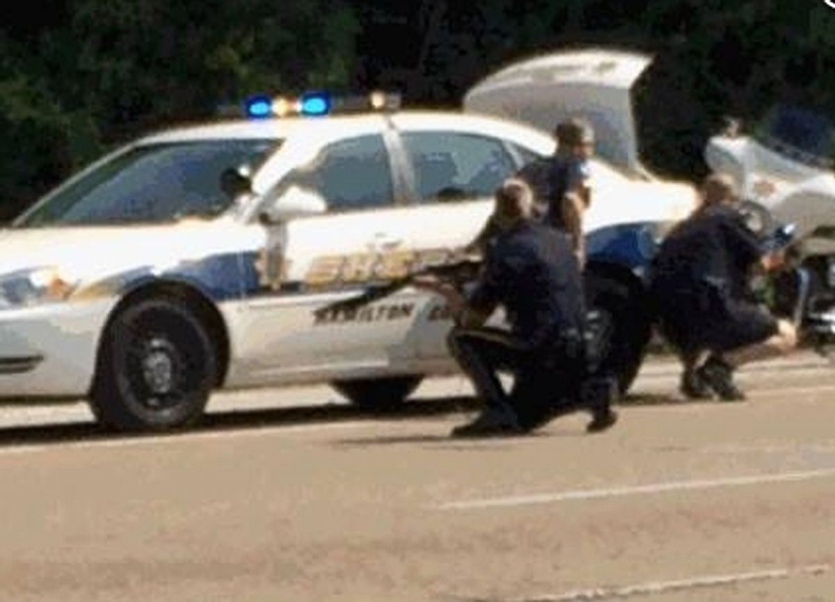 In this image made from video and released by WRCB-TV, authorities work an active shooting scene on amincola highway near the Naval Reserve Center, in Chattanooga, Tenn. on Thursday, July 16, 2015.  Chattanooga Mayor Andy Berke says police are pursuing an active shooter after reports of a shooting at the military reserve center.  (WRCB-TV via AP) MANDATORY CREDIT  (AP)