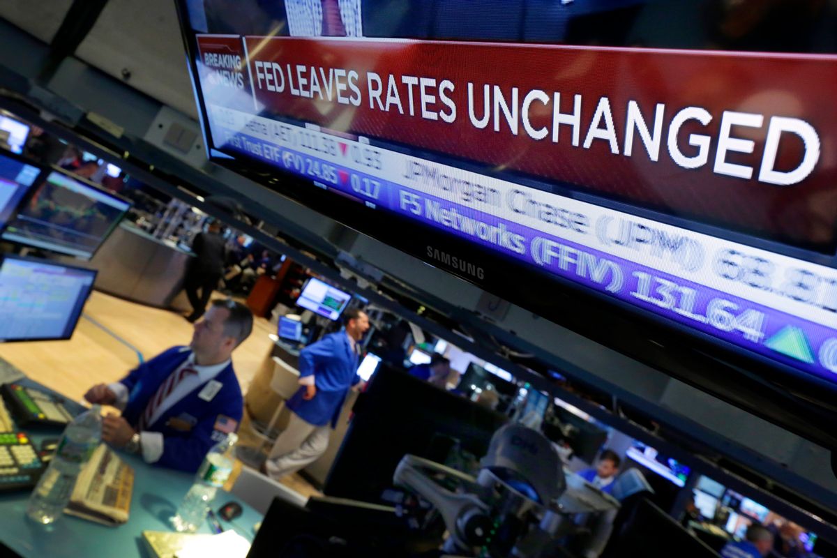 A television screen on the floor of the New York Stock Exchange shows the decision of the Federal Reserve, Wednesday, July 29, 2015. The Federal Reserve appears on track to raise interest rates later this year but is signaling that it wants to see further economic gains and higher inflation before doing so. (AP Photo/Richard Drew) (AP)