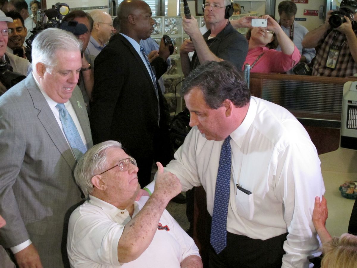 Former Maryland Rep. Larry Hogan, Sr., who is the father of Maryland Gov. Larry Hogan, gives a thumbs up to New Jersey Gov. Chris Christie, who made a campaign stop at a diner near Annapolis, Md., on Wednesday, July 15, 2015. Gov. Hogan, who endorsed Christie's presidential bid, is standing behind his father. (AP Photo/Brian Witte) (AP)