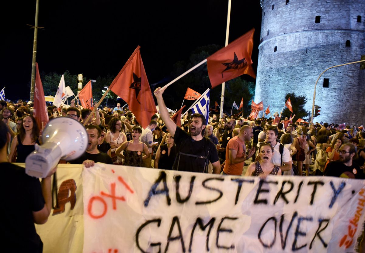 Supporters of the No vote celebrate after the results of the referendum in the northern Greek port city of Thessaloniki, Sunday, July 5, 2015. Greeks overwhelmingly rejected creditors demands for more austerity in return for rescue loans in a critical referendum Sunday, backing Prime Minister Alexis Tsipras, who insisted the vote would give him a stronger hand to reach a better deal. (AP Photo/Giannis Papanikos) (AP)