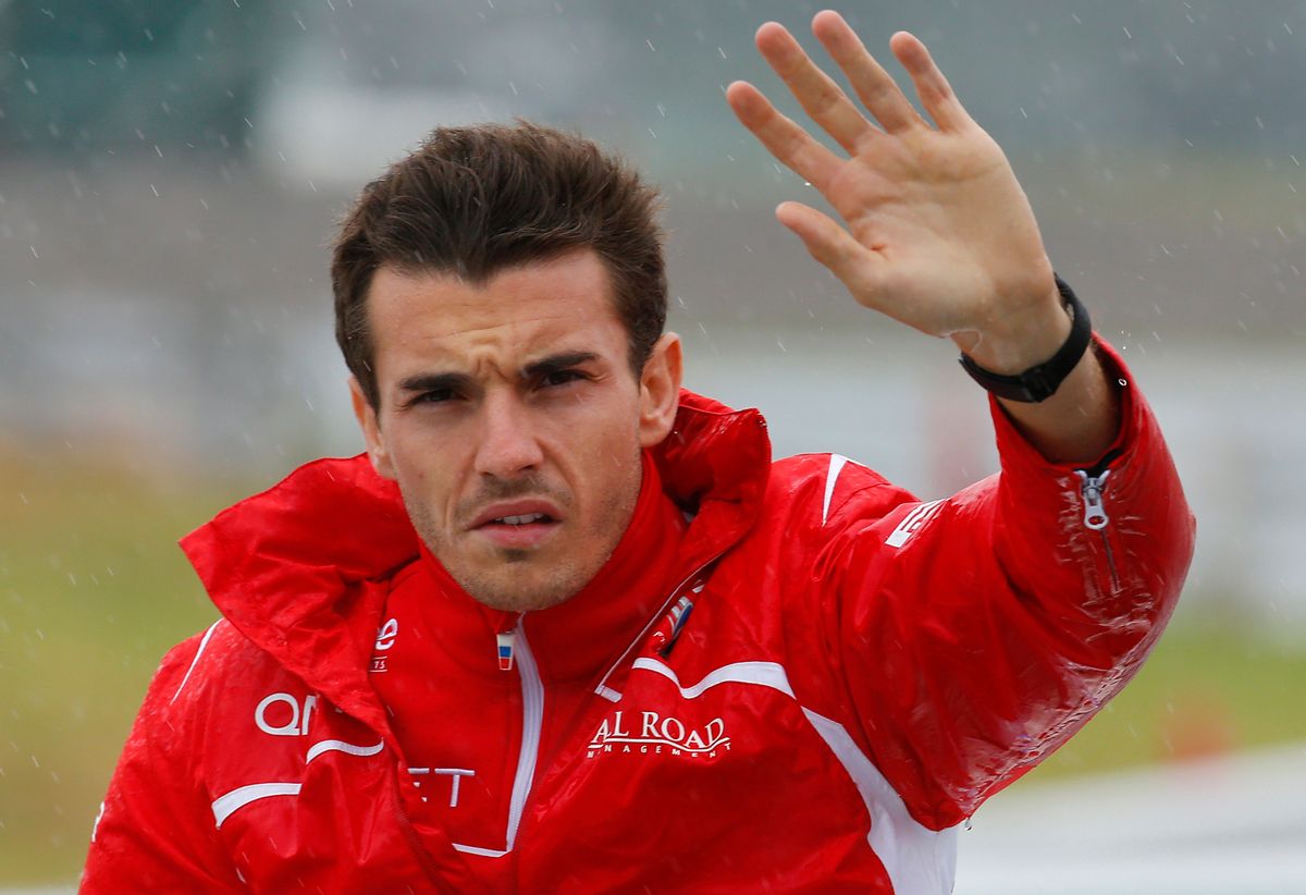 FILE - In this Oct. 5, 2014 file photo, Marussia driver Jules Bianchi of France waves during drivers' parade before the Japanese Formula One Grand Prix at the Suzuka Circuit in Suzuka, central Japan. His family says Bianchi has died from head injuries sustained in a crash at the Japanese Grand Prix. The news was posted on Bianchi's official Twitter feed early Saturday morning, July 18, 2015 French time and later confirmed by the Manor F1 team. Bianchi, 25, had been in a coma since the Oct. 5 accident, in which he collided at high speed with a mobile crane which was being used to pick up another crashed car. (AP Photo/Shizuo Kambayashi, File) (Shizuo Kambayashi)