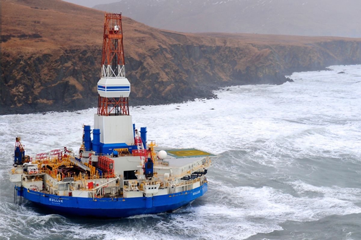 This aerial image provided by the U.S. Coast Guard shows the Royal Dutch Shell drilling rig Kulluk aground off a small island near Kodiak Island Tuesday, Jan. 1, 2013. No leak has been seen from the drilling ship that grounded off the island during a storm, officials said, as opponents criticized the growing race to explore the Arctic for energy resources. (AP Photo/U.S. Coast Guard)       