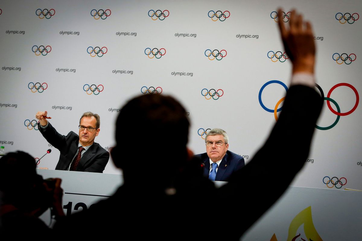 President of the International Olympic Committee (IOC) Thomas Bach, right, accompanied by Director of Communications of the IOC Mark Adams, left, takes a question from the floor during a press conference after the 128th International Olympic Committee (IOC) session in Kuala Lumpur, Malaysia on Monday, Aug. 3, 2015. (AP Photo/Joshua Paul) (Joshua Paul)