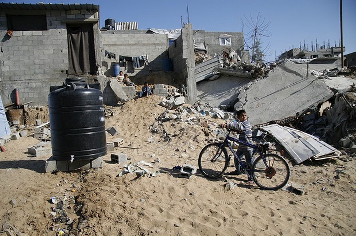 A Palestinian boy surrounded by destruction after Israel's 2008-09 attack on Gaza, Operation Cast Lead (Credit: Flickr/gloucester2gaza)