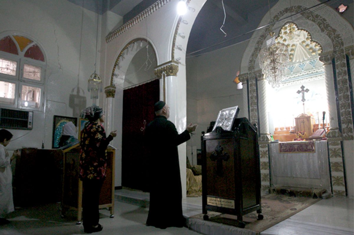 People attend a mass at the Syriac Orthodox Church in Al-Darbasiyah, Hasakah province November 13, 2013.   (Reuters)