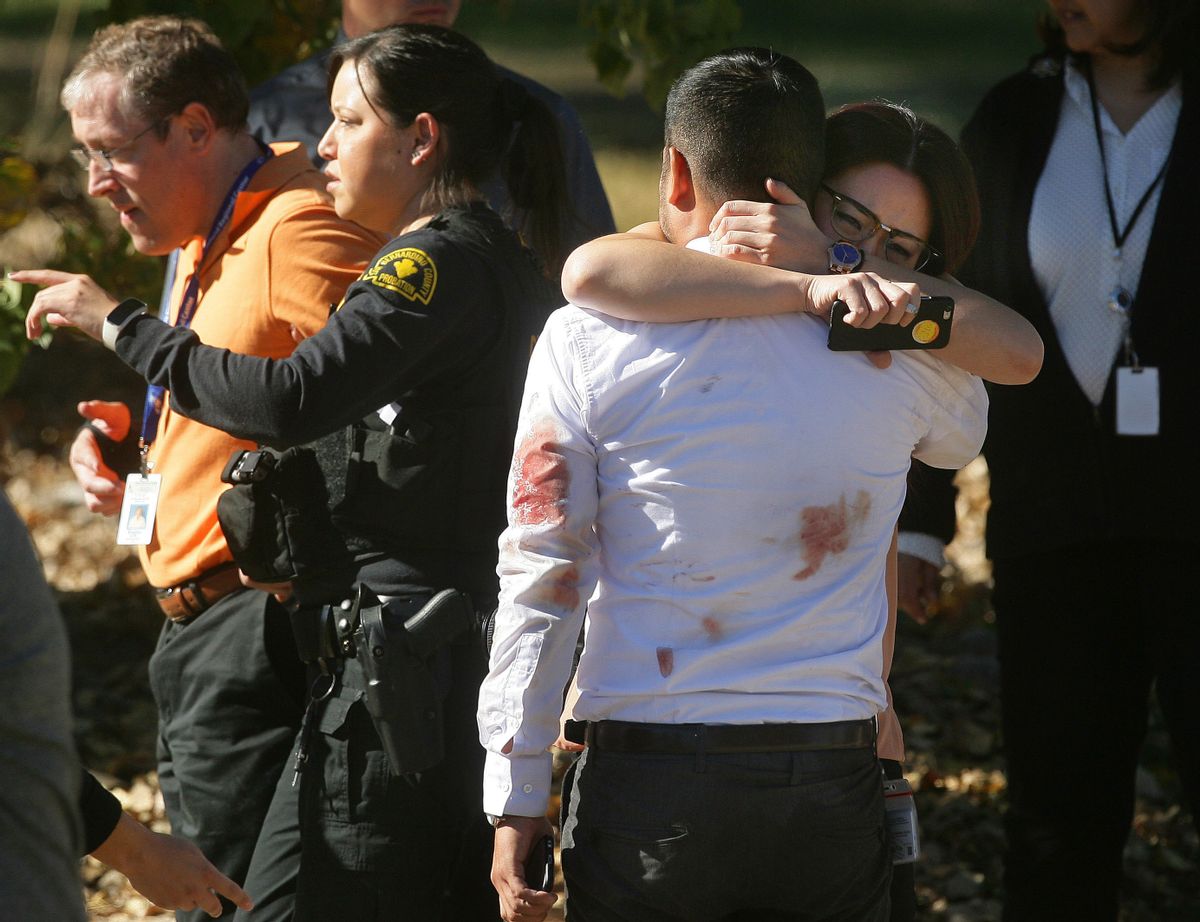 A couple embraces following a shooting that killed multiple people at a social services facility, Wednesday, Dec. 2, 2015, in San Bernardino, Calif. (David Bauman/The Press-Enterprise via AP)  MAGS OUT; MANDATORY CREDIT; LOS ANGELES TIMES OUT (AP)