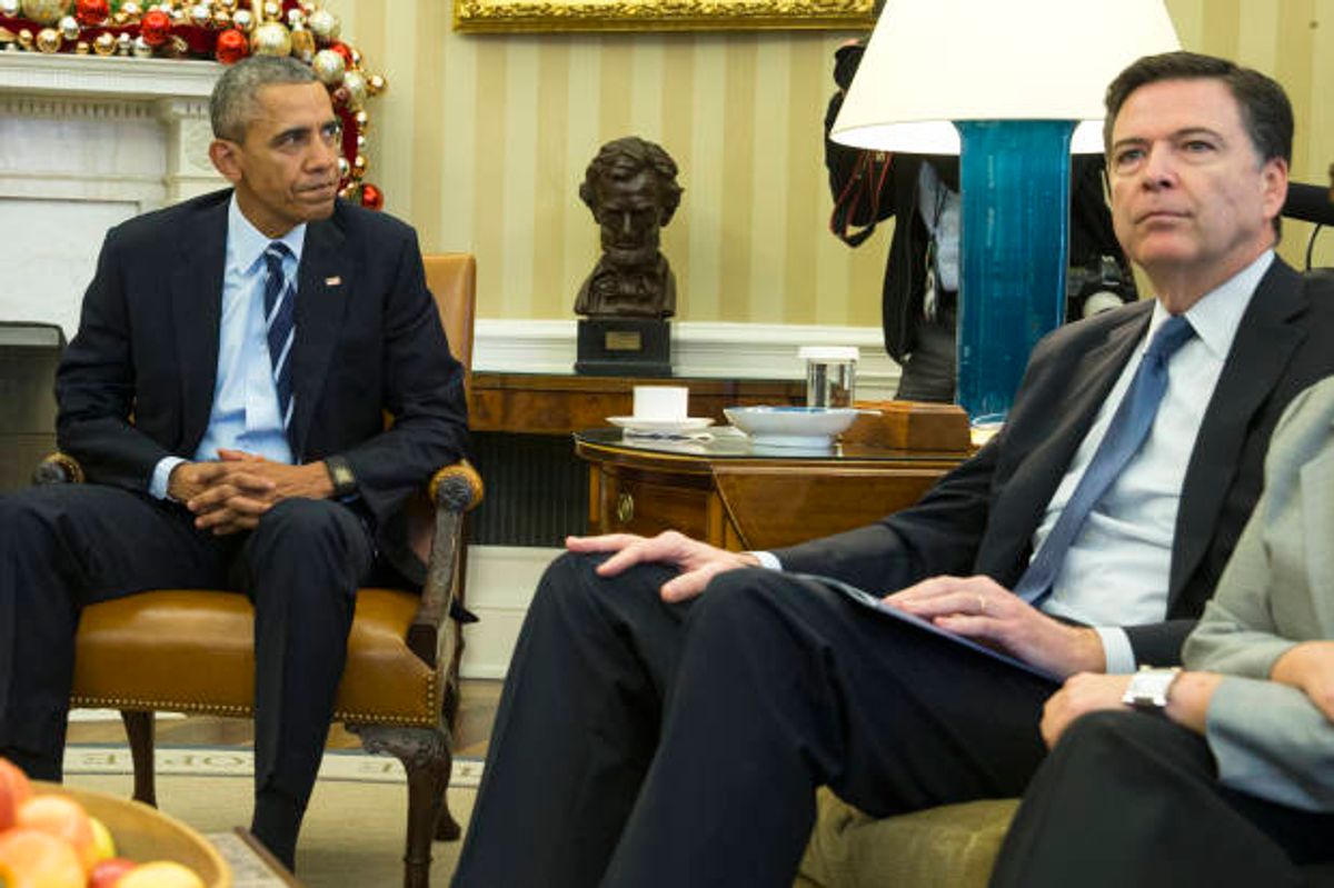President Barack Obama sits with FBI director James Comey  (AP Photo/Evan Vucci)