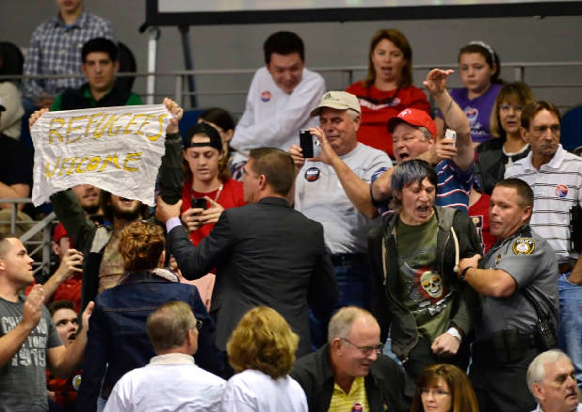 Protesters are removed during a town hall meeting with Republican presidential candidate Donald Trump in the Convocation Center on the University of South Carolina Aiken campus Saturday, Dec. 12, 2015, in Aiken, S.C. (AP Photo/Richard Shiro) (AP)
