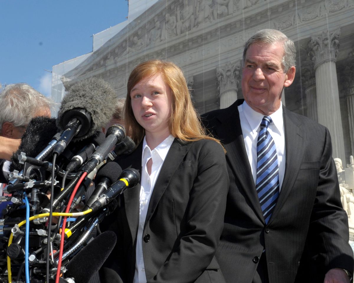 FILE - In this Oct. 10, 2012, file photo, Abigail Fisher, the Texan involved in the University of Texas affirmative action case, accompanied by her attorney Bert Rein, talks to reporters outside the Supreme Court in Washington. Consideration of race in college admissions is again in line of fire at the Supreme Court on Wednesday, Dec. 9, 2015, for the second time in three years, in the case of Fisher, a white Texas woman who was rejected for admission at the University of Texas. (AP Photo/Susan Walsh) (AP)