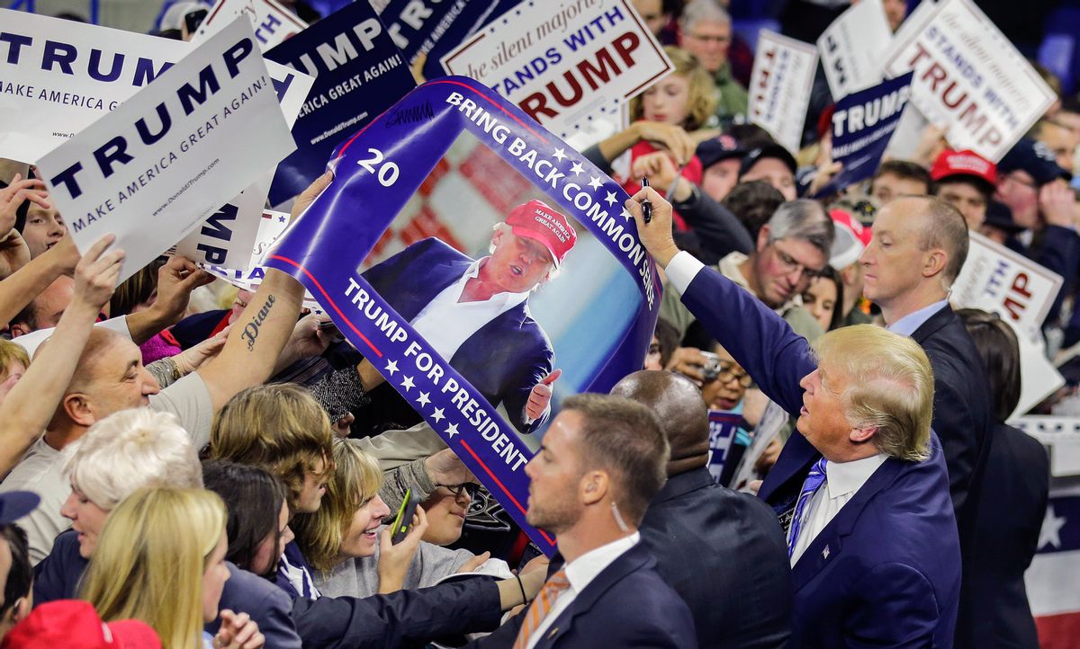 Republican presidential candidate Donald Trump signs autographs for supporters during a campaign stop at the Tsongas Center in Lowell, Mass., Monday, Jan. 4, 2016. (AP Photo/Charles Krupa) (AP)