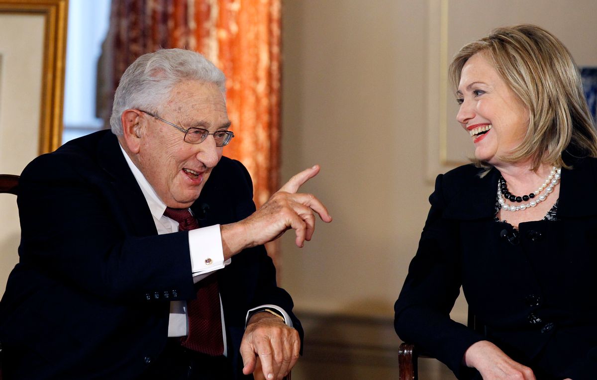 Former Secretary of State Henry Kissinger and Secretary of State Hillary Rodham Clinton talk during an interview by PBS' Charlie Rose (Associated Press)
