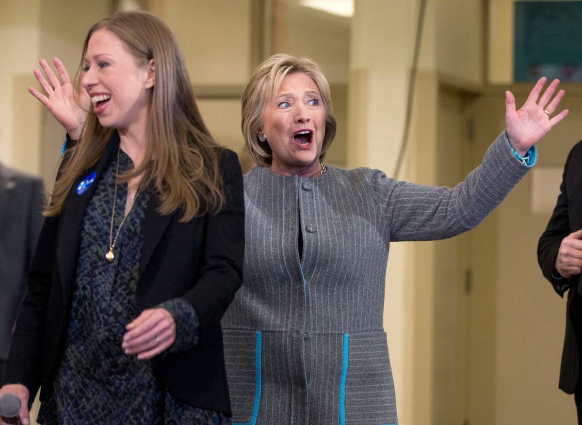 Democratic presidential candidate Hillary Clinton, accompanied by her daughter Chelsea Clinton, reacts to applause as she arrives for a rally at Abraham Lincoln High School in Council Bluffs, Iowa, Sunday, Jan. 31, 2016. (AP Photo/Andrew Harnik) (AP)