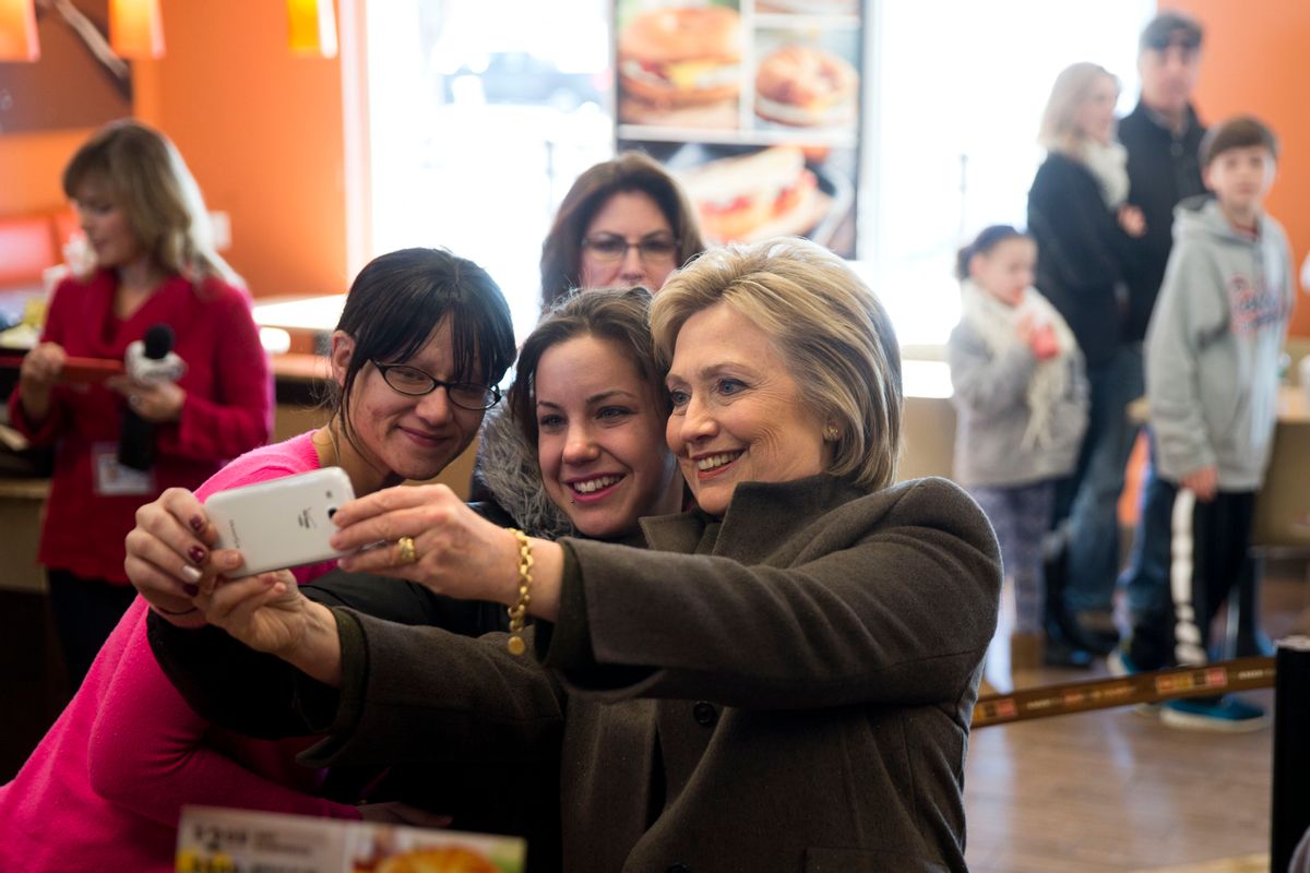 Democratic presidential candidate Hillary Clinton makes a selfie with customers, Sunday, Feb. 7, 2016, at a Dunkin' Donuts in Manchester, N.H.  (AP)