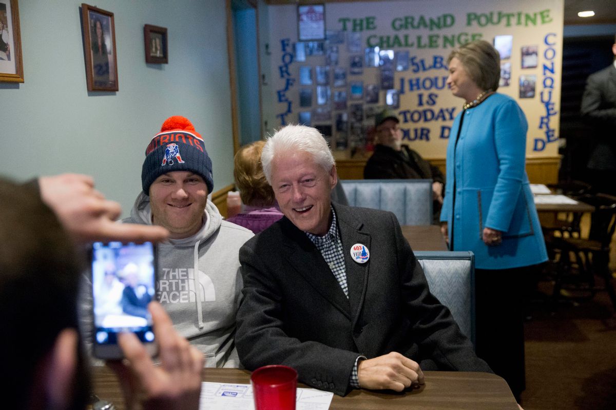 Democratic presidential candidate Hillary Clinton and her husband former President Bill Clinton meet with costumers before eating breakfast, Monday, Feb. 8, 2016, at Chez Vachon restaurant in , N.H. (AP Photo/Matt Rourke) (AP)