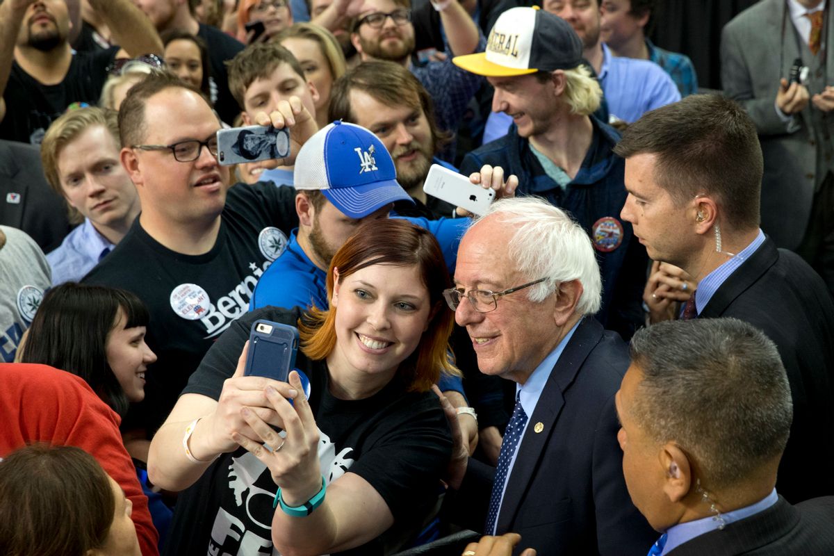 Democratic presidential candidate Sen. Bernie Sanders, I-Vt., takes selfies with the crowd during a campaign rally at the Cox Convention Center Arena in Oklahoma City, Okla., Sunday, Feb. 28, 2016. (AP Photo/Jacquelyn Martin) (AP)