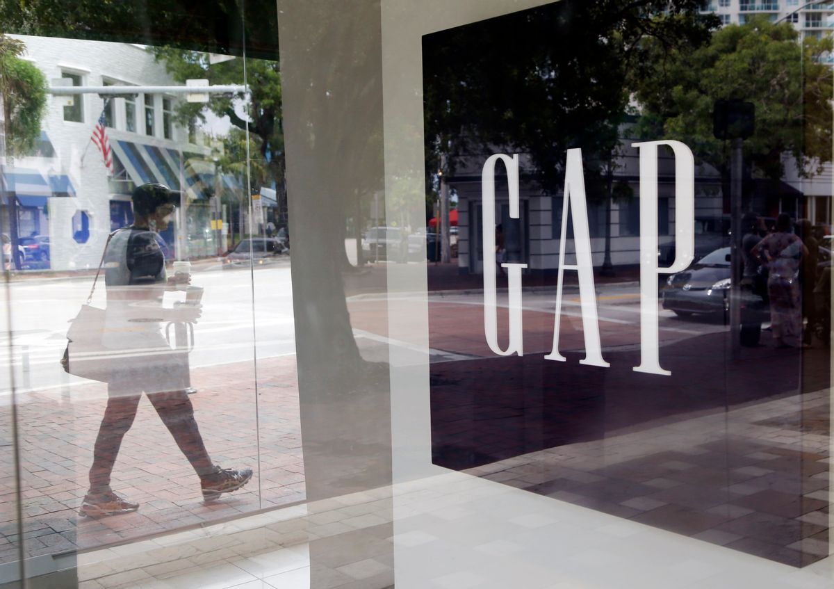 In this Saturday, Aug. 15, 2015, photo, a pedestrian walks past a Gap store in Miami.  (AP Photo/Lynne Sladky) (AP)