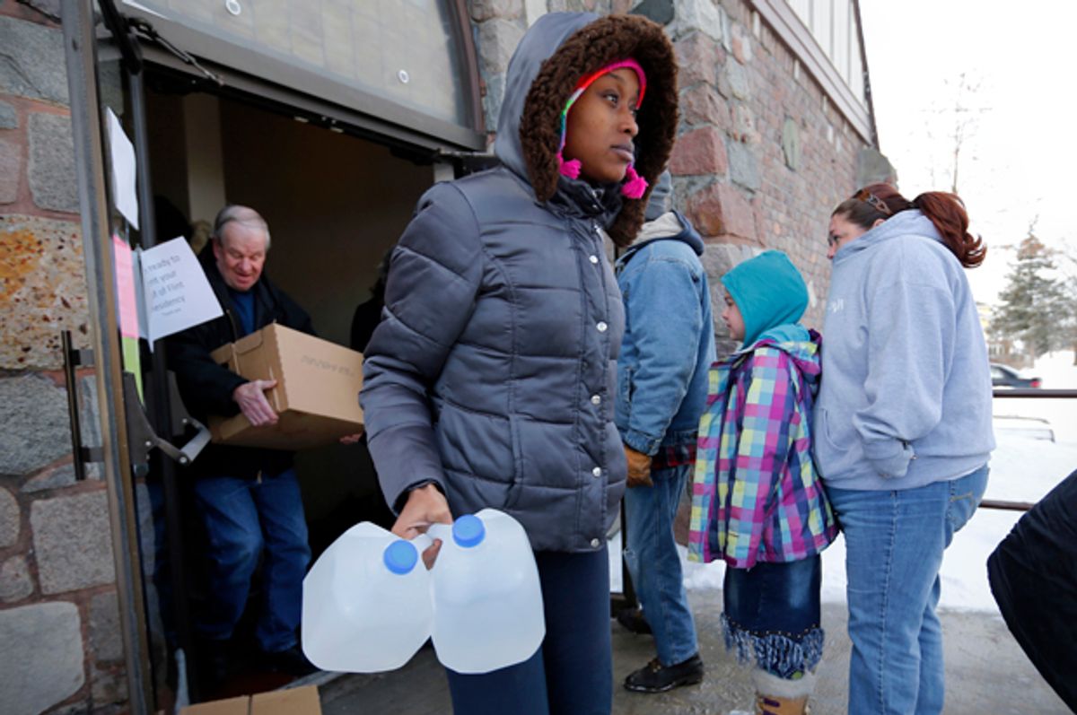 Water is distributed at the Lincoln Park United Methodist Church in Flint, Mich, Feb. 3, 2015.   (AP/Paul Sancya)