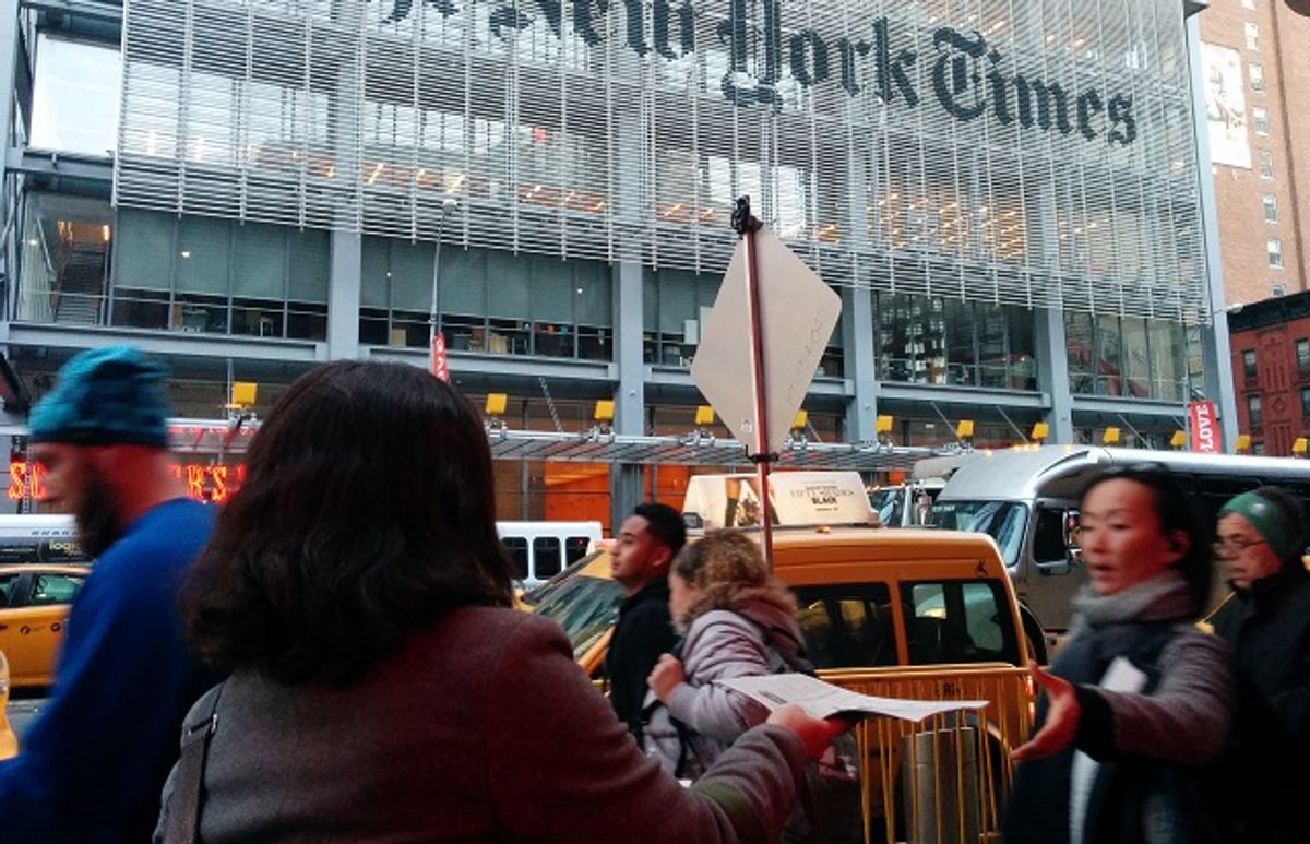 An activist handing out the fake New York Times edition outside of the real newspaper's building  (NYT-IP/JVP/Jews Say No!)