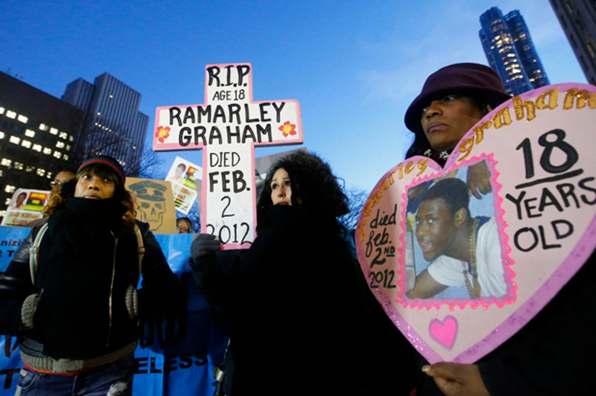 Constance Malcolm, mother of fatal police shooting victim Ramarley Graham, left, stands with protesters in front of the U.S. Attorney's office, Dec. 19, 2014, in New York.   (AP/Jason DeCrow)