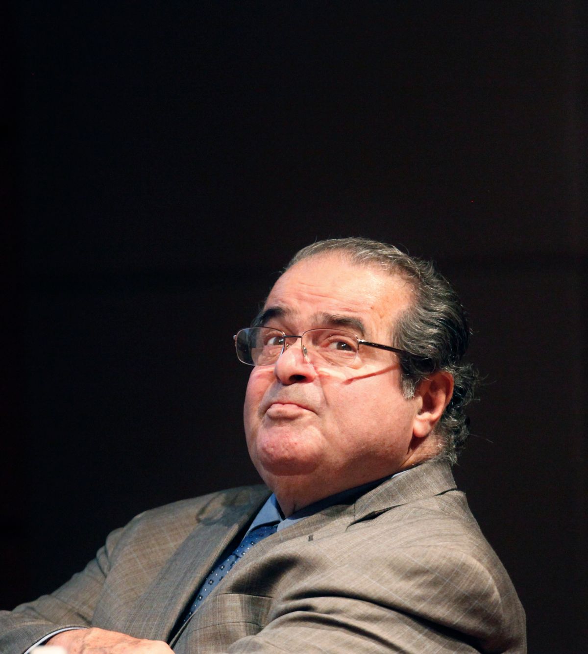 FILE - In this Oct. 18, 2011 file photo, U.S. Supreme Court justice Antonin Scalia looks into the balcony before addressing the Chicago-Kent College Law justice in Chicago. A letter from the Supreme Court's doctor says Scalia suffered from coronary artery disease, obesity and diabetes, among other ailments that probably contributed to the justice's sudden death. (AP Photo/Charles Rex Arbogast, File) (AP)