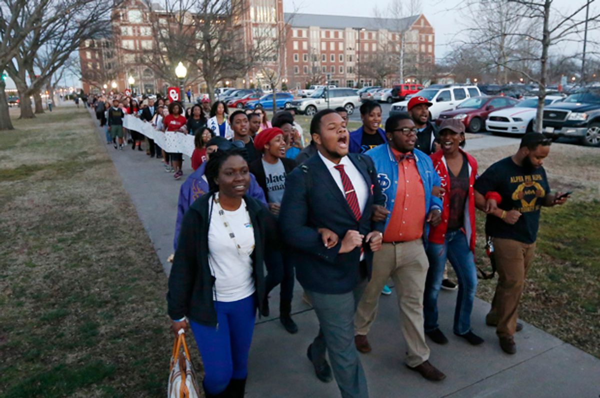 University of Oklahoma students march to the now closed University of Oklahoma's Sigma Alpha Epsilon fraternity house during a rally in Norman, Okla., March 10, 2015.   (AP/Sue Ogrocki)