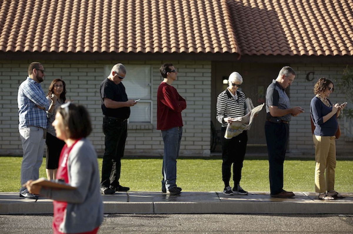 People wait to vote in the presidential primary election outside a polling site in Glendale, Arizona on March 22, 2016, after 70 percent of polling locations were cut  (Reuters/Nancy Wiechec)