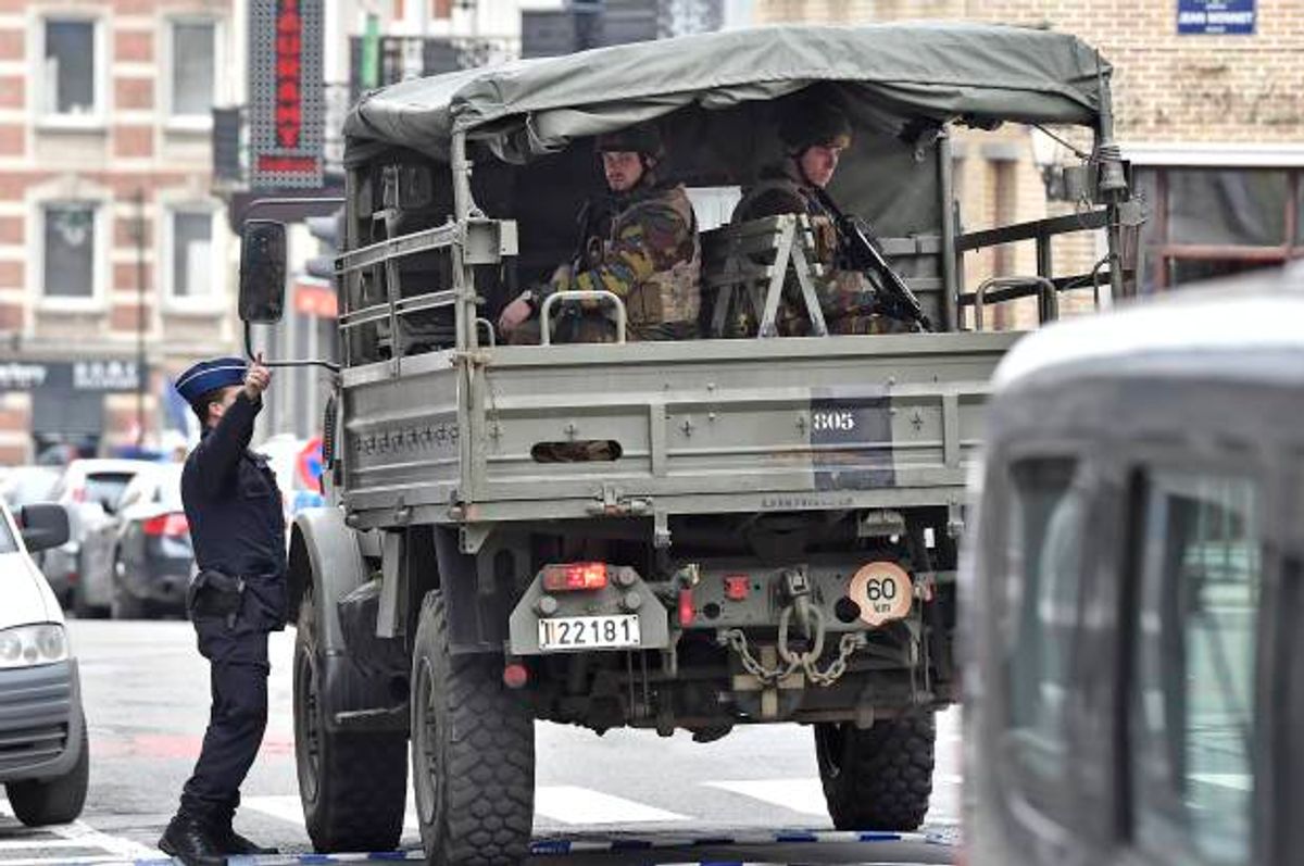 Police and military patrol the city center in Brussels, Belgium after attacks claimed by ISIS, on Tuesday, March 22, 2016  (AP/Martin Meissner)