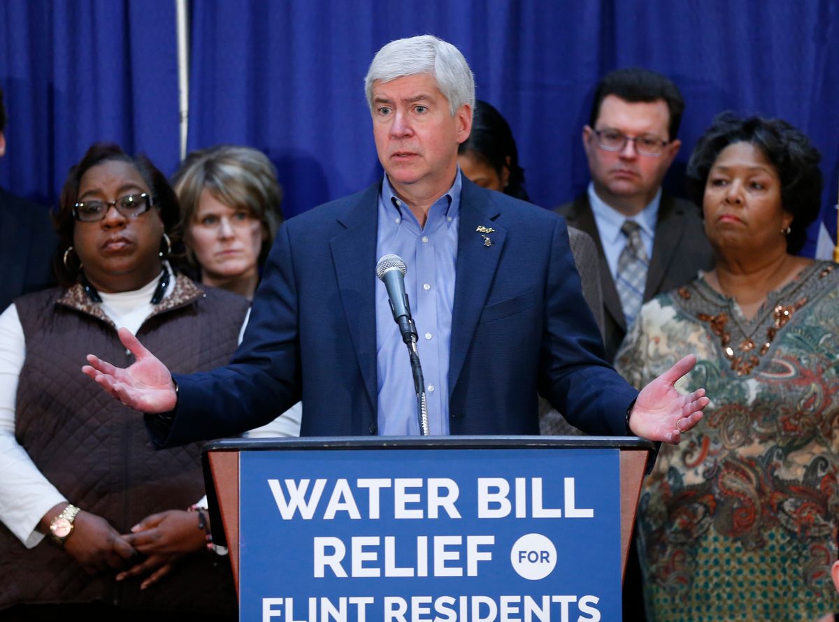 In this Feb. 26, 2016 photo, Gov. Rick Snyder speaks after attending a Flint Water Interagency Coordinating Committee meeting in Flint, Mich. The state of Michigan restricted Flint from switching water sources last April unless it got approval from Gov. Rick Snyder's administration under the terms of a $7 million loan needed to help transition the city from state management, according to a document released Wednesday, March 2, 2016. (AP Photo/Paul Sancya) (AP)