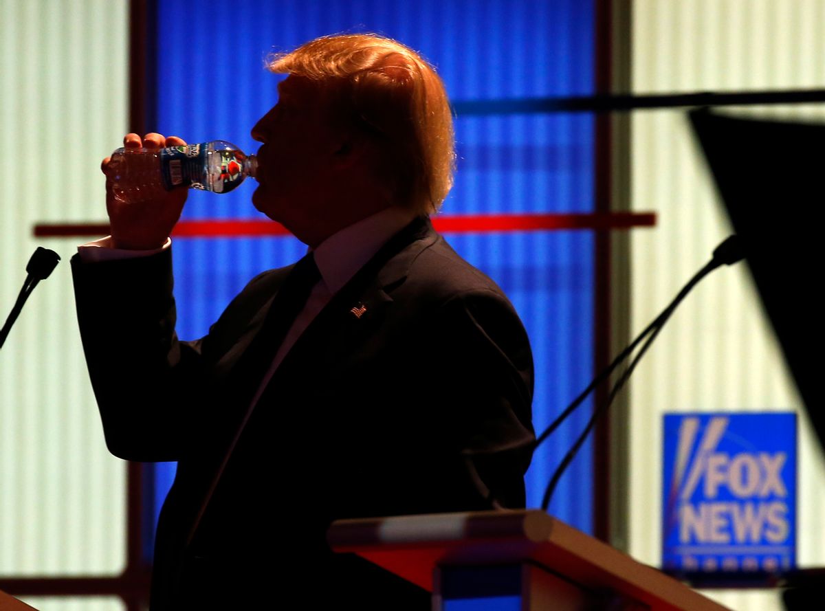 Republican presidential candidate, businessman Donald Trump takes a drink of water during a commercial break at a Republican presidential primary debate at Fox Theatre, Thursday, March 3, 2016, in Detroit. (AP Photo/Paul Sancya) (AP)
