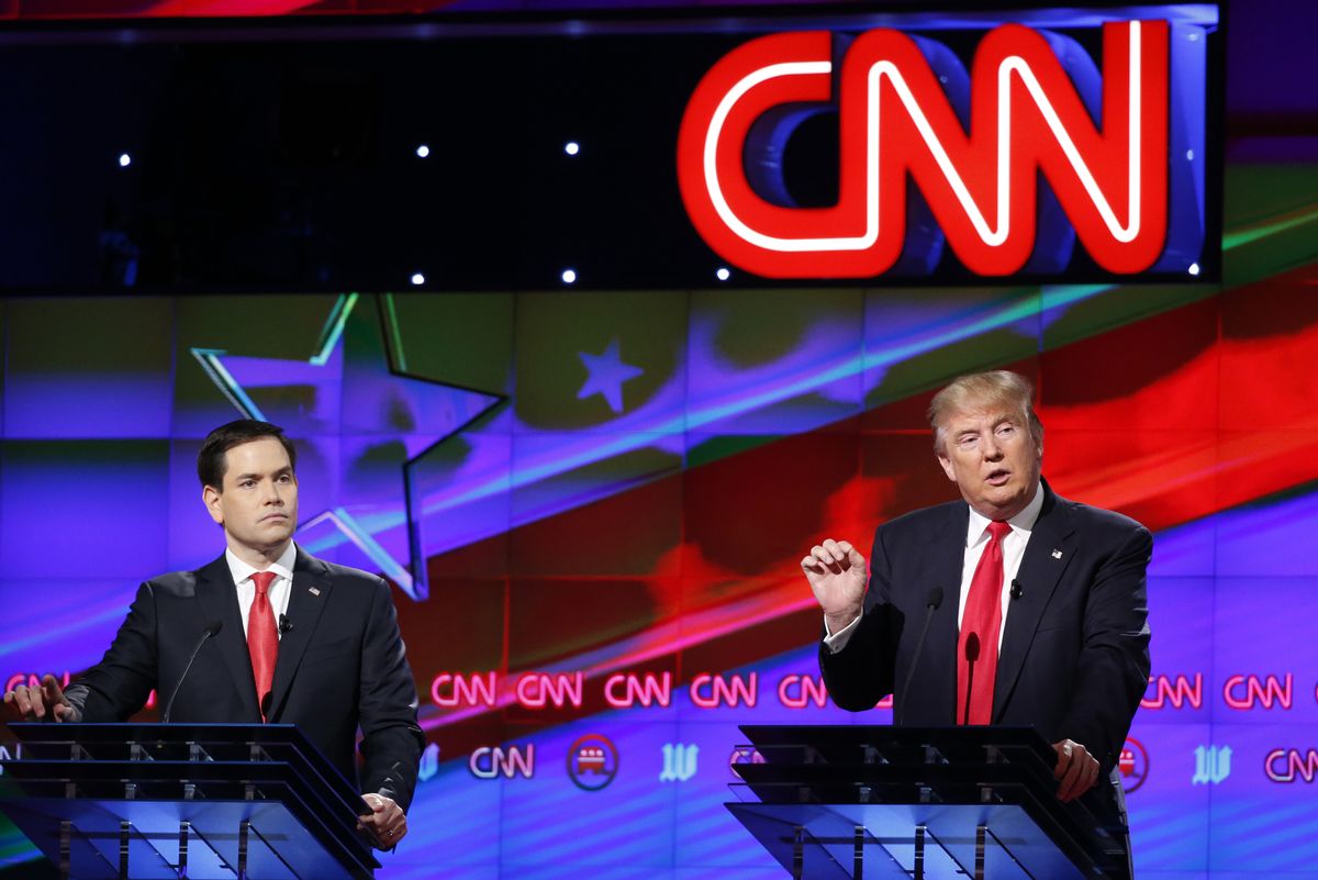 Republican presidential candidate, businessman Donald Trump, speaks as Republican presidential candidate, Sen. Marco Rubio, R-Fla., listens, during the Republican presidential debate sponsored by CNN, Salem Media Group and the Washington Times at the University of Miami,  Thursday, March 10, 2016, in Coral Gables, Fla. (AP Photo/Wilfredo Lee) (AP)