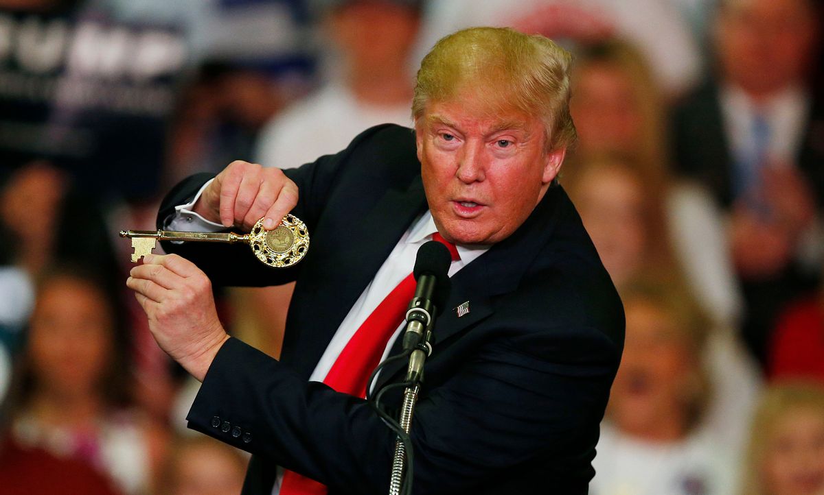 Republican presidential candidate Donald Trump holds up a key to the city he brought onto stage with him as he speaks at a campaign rally Monday, March 7, 2016, in Madison, Miss. (AP Photo/) (AP/Brynn Anderson)