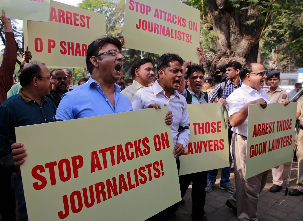 FILE - In this Feb. 17, 2016, file photo, Indian journalists hold placards during a protest against attack on journalists in Mumbai, India. Indian journalists say they face more violent threats and attacks for questioning government policy or the wisdom of Prime Minister Narendra Modi. Some have been threatened hundreds, even thousands, of times. Government and ruling-party officials have denied responsibility, while taking a hard line against anyone viewed as anti-Indian. (AP Photo/Rafiq Maqbool, File) (AP)