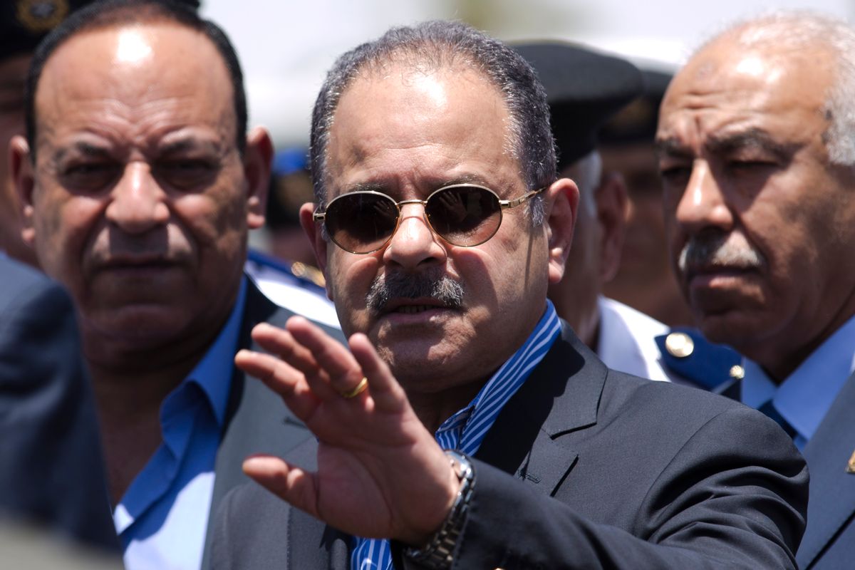 FILE -- In this June 11, 2015 file photo, Egypt's Interior Minister Magdy Abdel-Ghaffar, center, visits the site of a suicide bombing near the Karnak Temple in Luxor, Egypt. In a televised appearance on state and private television, Sunday, March,6, 2016, Abdel-Ghaffar blamed the Muslim Brotherhood and Islamic militant group Hamas for the killing last June, of Hisham Barakat, the countrys chief prosecutor who oversaw cases against thousands of Islamists. Abdel-Ghaffar said Hamas trained Brotherhood members in the Gaza Strip for the operation. (AP Photo/Hassan Ammar, File) (AP)