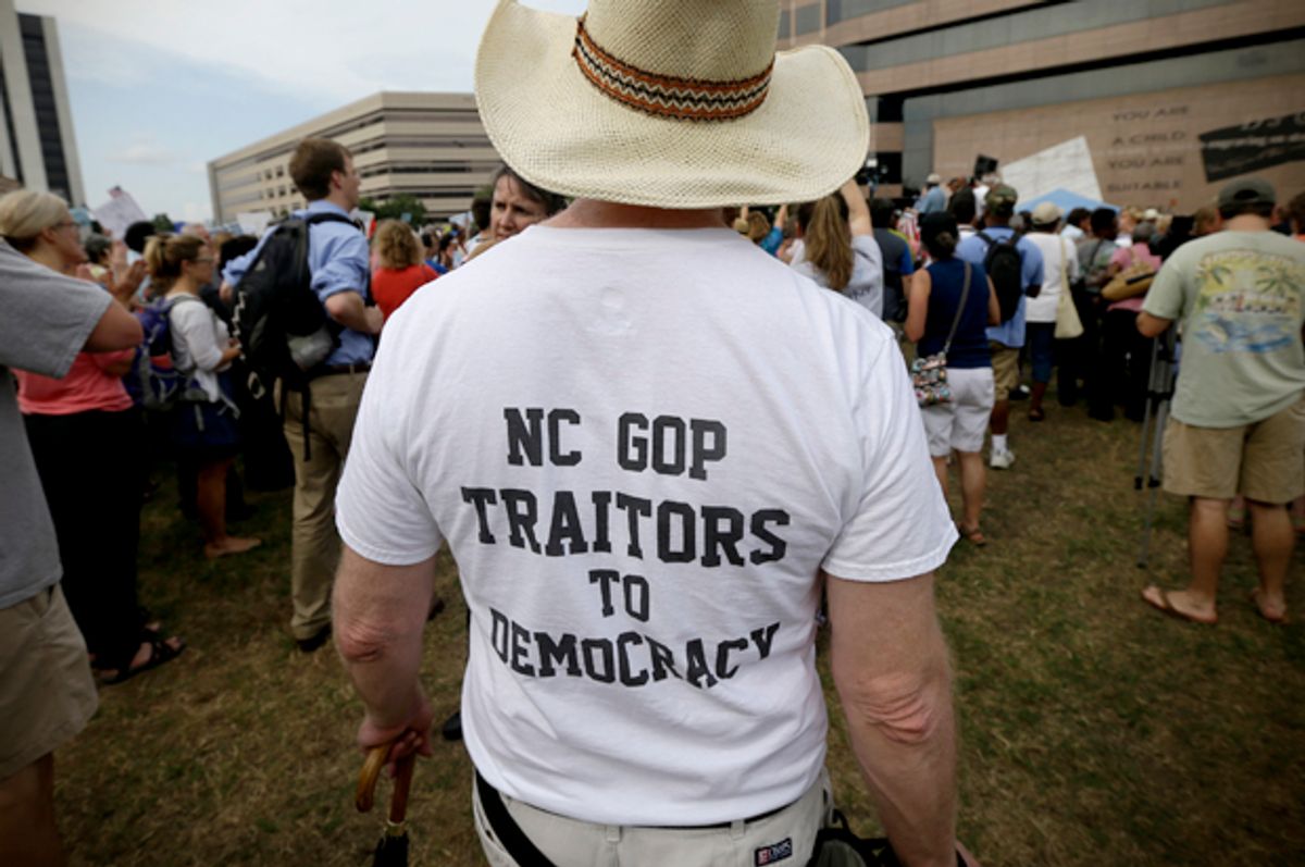 Demonstrators congregate at Halifax Mall during "Moral Monday" protests in Raleigh, N.C., June 24, 2013.  (AP/Gary Broome)