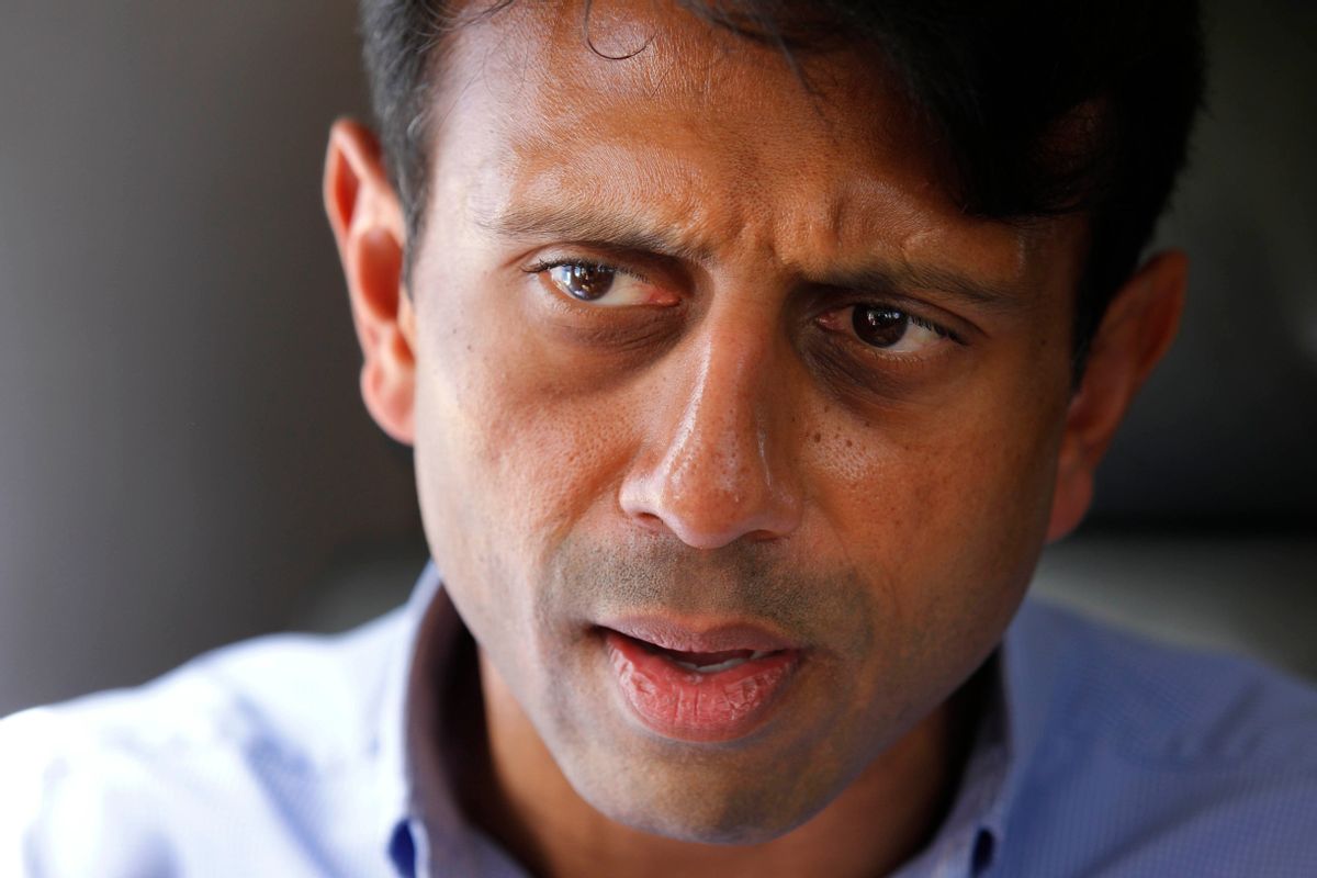FILE - In this July 20, 2010 file photo, Louisiana Gov. Bobby Jindal talks about the oil spill as he flies over the Deepwater Horizon oil spill site in the Gulf of Mexico, off the Louisiana coast. Jindal left the governors office nearly two months ago, but his legacy permeates a special legislative session aimed at digging Louisiana out of deep financial troubles. Criticism of Jindal is bipartisan and widespread, with irritated lawmakers left sifting through the highly-unpopular choices of raising taxes or taking a hatchet to higher education and government services. (AP Photo/Gerald Herbert, File) (AP)