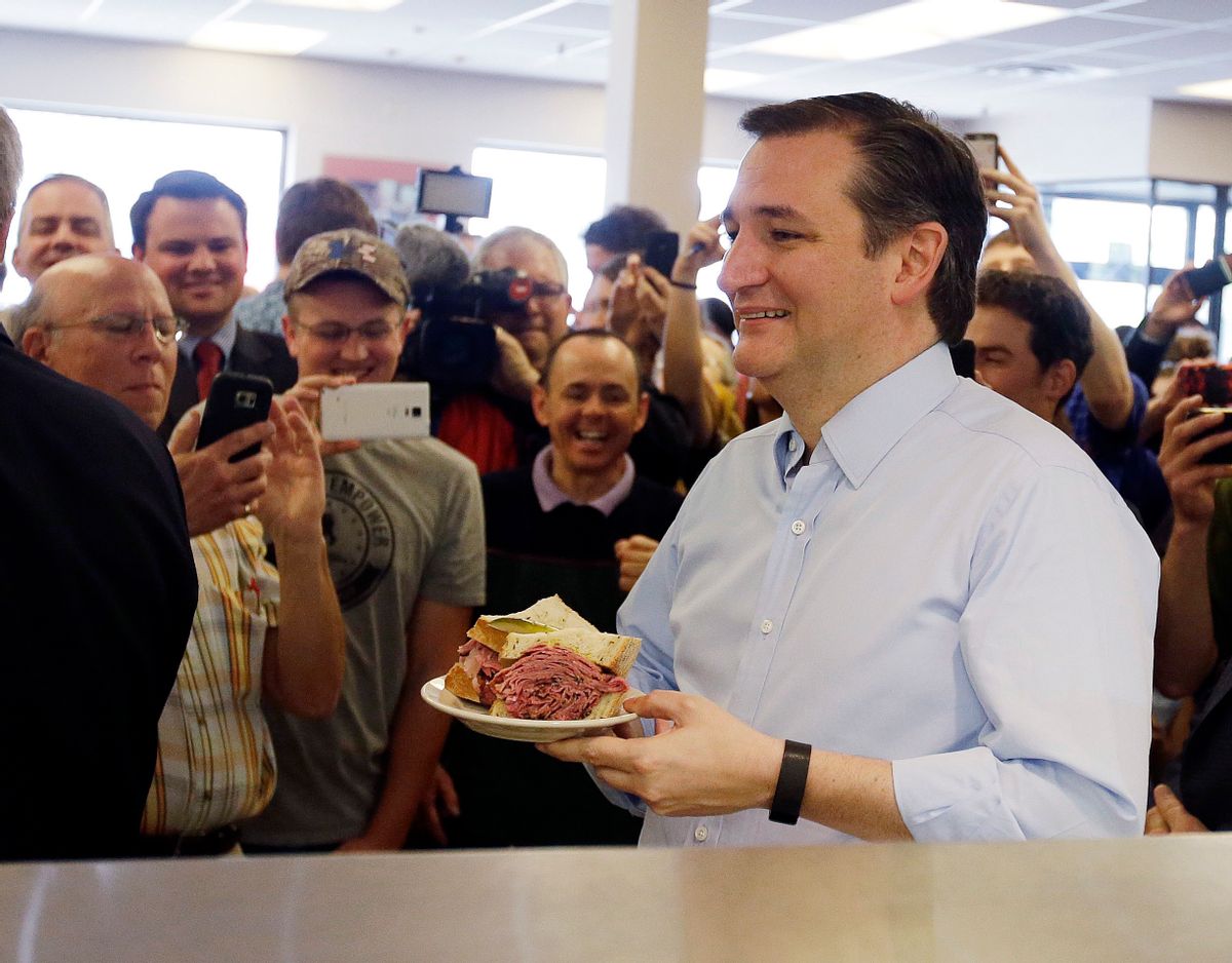 Sen. Ted Cruz, R-Texas holds a sandwich. (AP Photo/Darron Cummings)