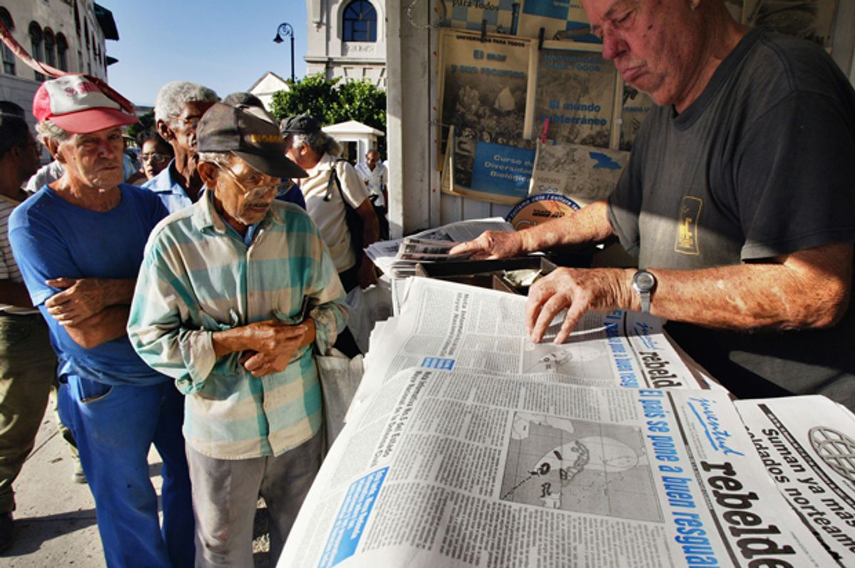 Cubans stand in line in Havana, Cuba, to buy newspapers, Sept. 11, 2004.   (AP/Jose Goitia)