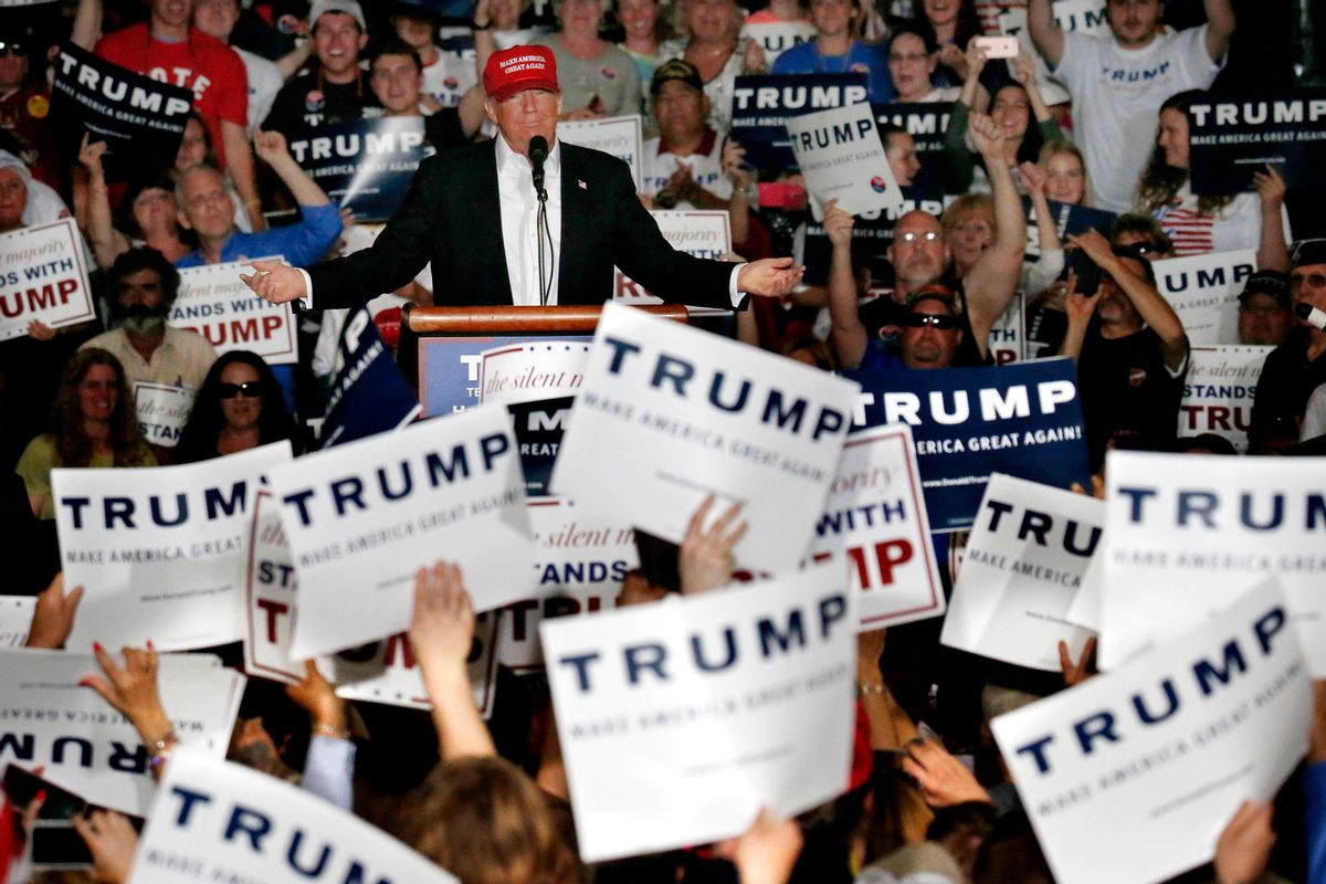 Republican presidential candidate Donald Trump speaks during a rally, Friday, April 22, 2016, at the Delaware State Fairgrounds in Harrington, Del. As his top aides spent the week gingerly courting Republican insiders at a seaside resort in Florida, Trump was busy railing against them. The system is all rigged, Trump told supporters at a rally Friday. (AP Photo/Julio Cortez) (AP)