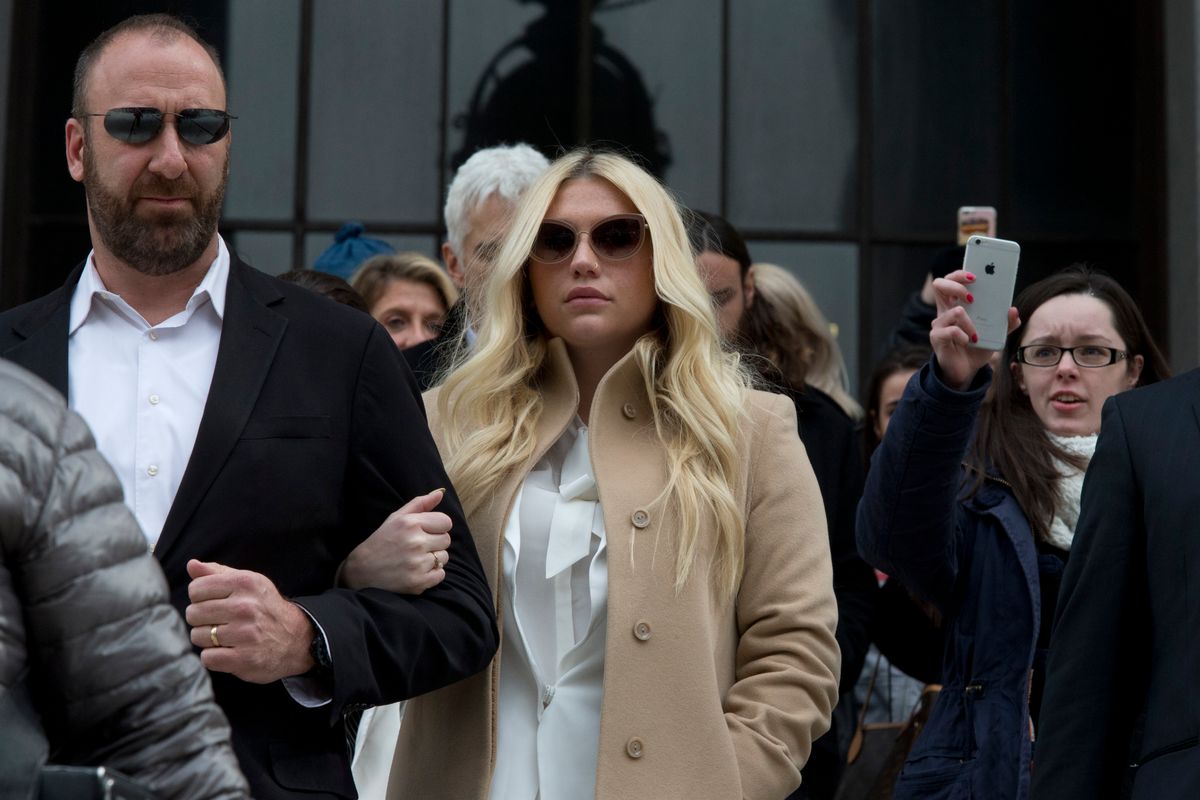 FILE - In this Feb. 19, 2016 file photo, pop star Kesha, center, leaves Supreme court in New York. On Wednesday, April 6, 2016, a New York judge threw out her hate-crime and human-rights claims against her former producer Dr. Luke. Manhattan state Supreme Court Justice Shirley Werner Kornreich said Kesha's claims that Dr. Luke raped and abused her can't go forward because the alleged incidents happened outside New York and beyond the legal time limit. (AP Photo/Mary Altaffer, File) (AP)