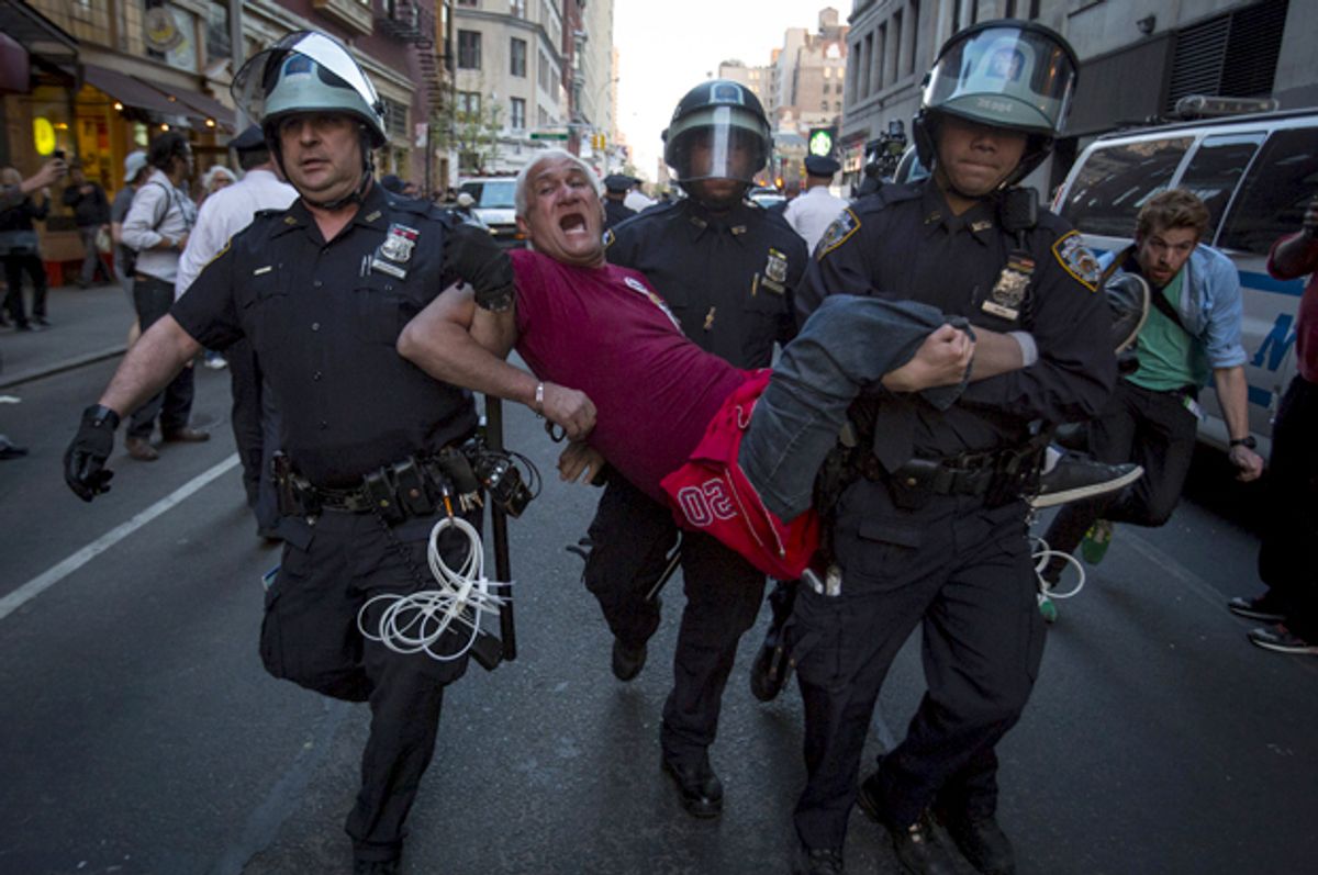 A protester is detained by New York police during a demonstration calling for social, economic and racial justice, in New York City, April 29, 2015.   (Reuters/Andrew Kelly)