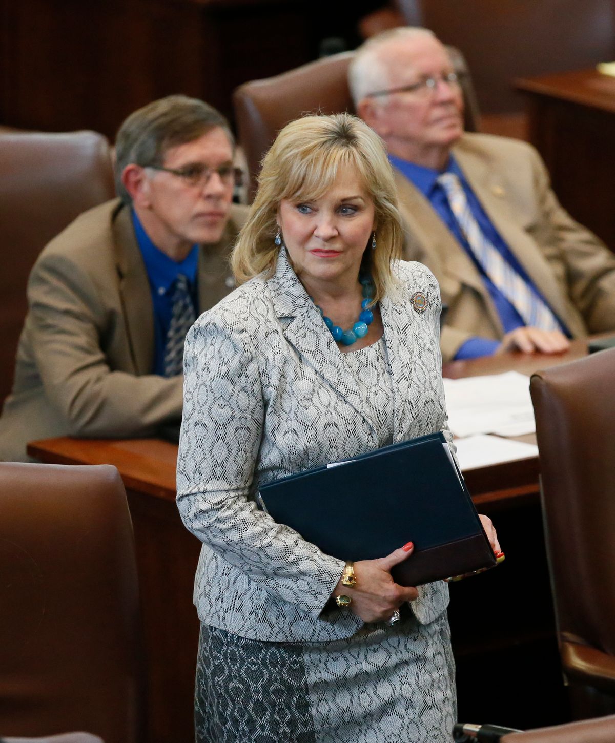 In this May 18, 2016, file  photo, Oklahoma Gov. Mary Fallin walks on the floor of the Oklahoma House in Oklahoma City. Gov. Fallin has vetoed legislation that would make it a felony for doctors to perform an abortion, a measure that would have effectively outlawed the procedure in the state. The Republican governor issued her veto Friday, May 20, 2016, saying the bill was vague and would not withstand a legal challenge. (AP Photo/Sue Ogrocki, File) (AP)
