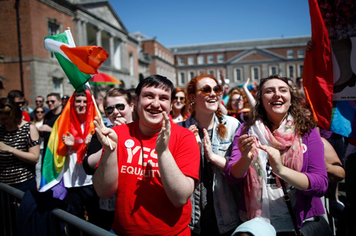 Yes supporters celebrate as first results in the Irish referendum start to come through at Dublin castle,  Ireland, May 23, 2015.     (AP/Peter Morrison)